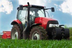 Red tractor in field